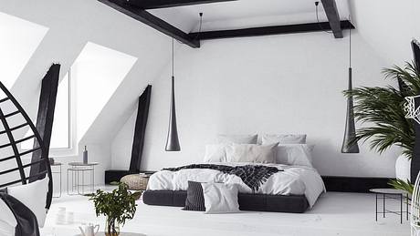 Ein urban eingerichtetes Schlafzimmer mit Dachschräge und großer Fensterfront - Foto: Artjafara/iStock