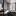 Graue Vorhänge vor Fensterfront im Schlafzimmer - Foto: iStock/ in4mal