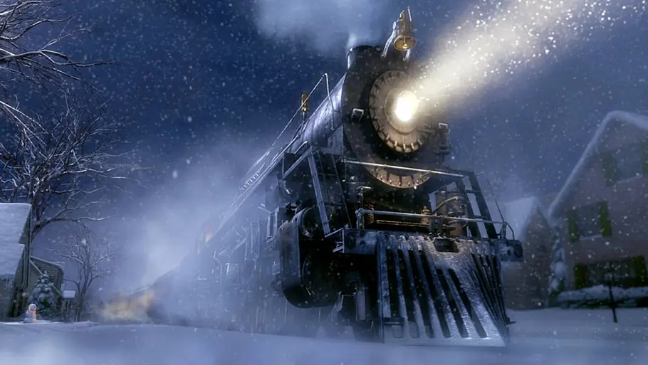 Weihnachtsfilm Der Polarexpress Der Polarexpress fährt durch den Schnee und hat eine strahlende Lampe vorne dran.